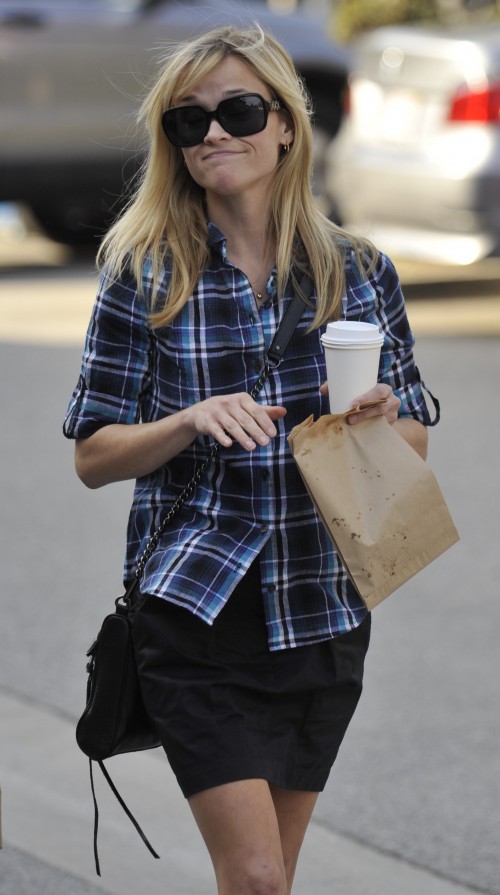 Reese Witherspoon catches up with a friend as she spends the afternoon in Brentwood, Ca