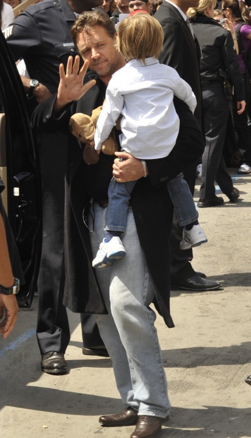 Academy Award winner Russell Crowe carries his son to the car after getting his star on the Hollywood Walk of Fame in Hollywood, Ca