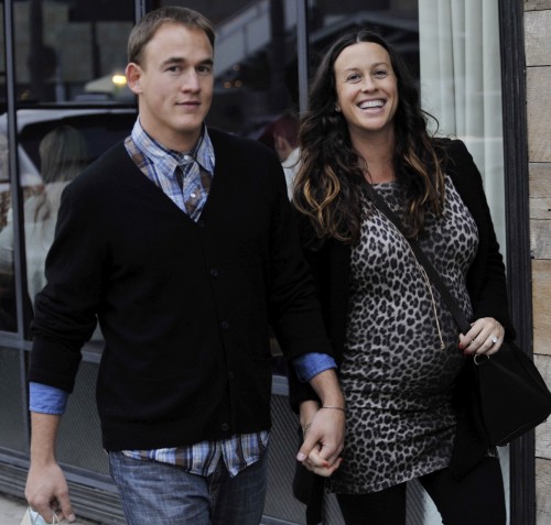 Alanis Morrisette and husband all smiles as they walk hand in hand in Venice, Ca